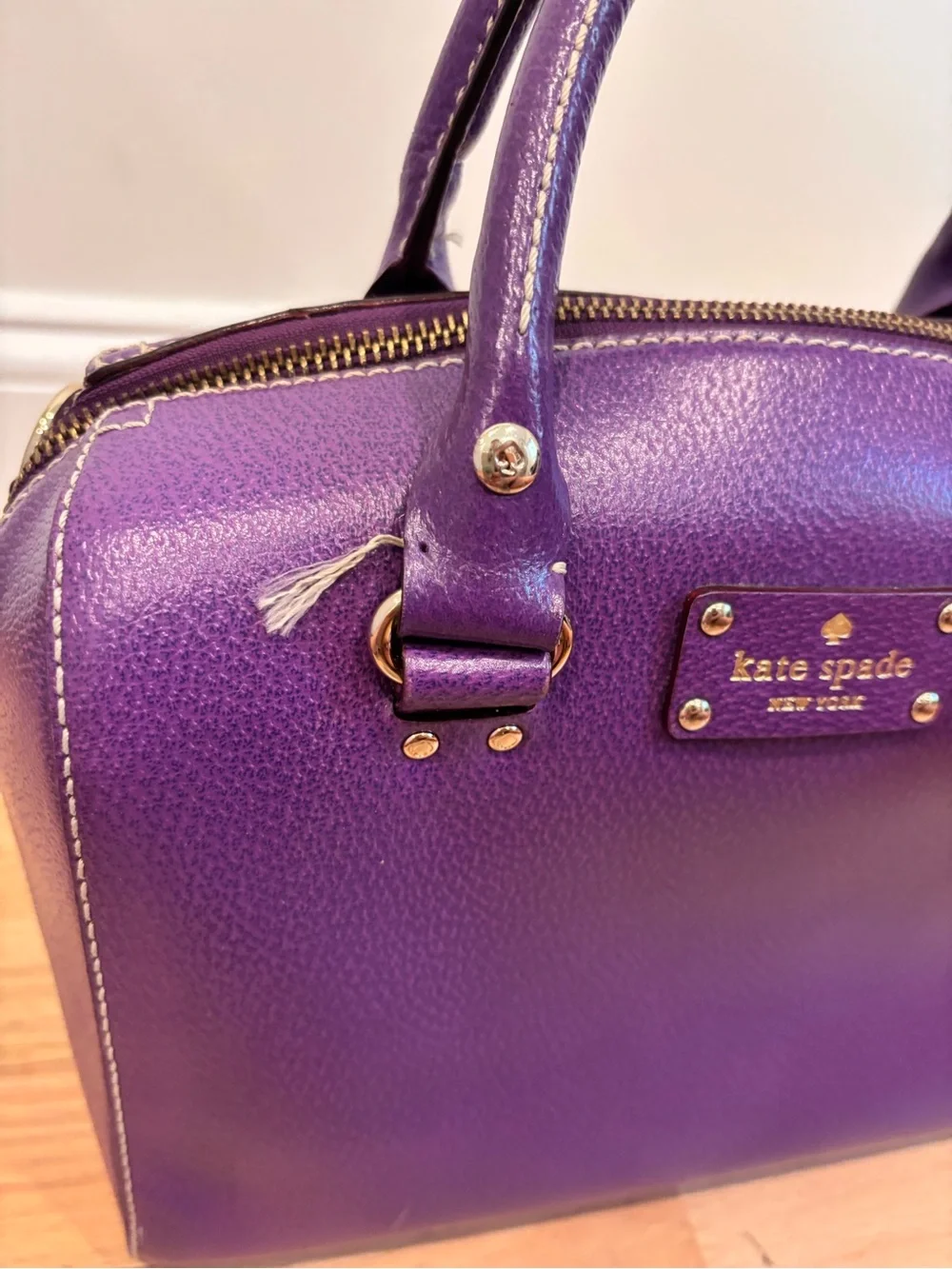 Kate Spade Alessa Wellesley handbag in a vibrant plumberry purple leather